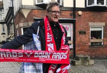 A man selling scarves in Ashbourne on the two days of Shrovetide. Photo: John Grant