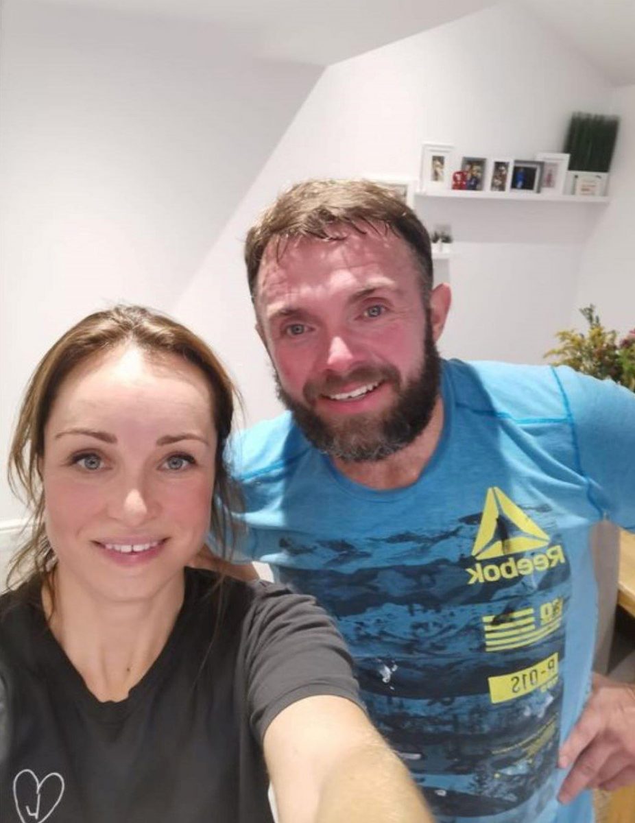 Michelle and her husband after a home workout
