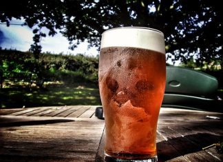 A pint of beer on an outdoor table