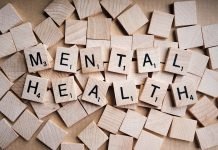 Pictured is the word 'mental health' made out of tiled letters