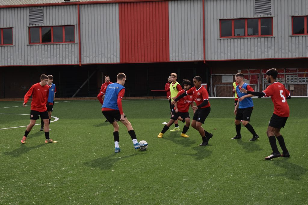 Walsall FC students playing football.