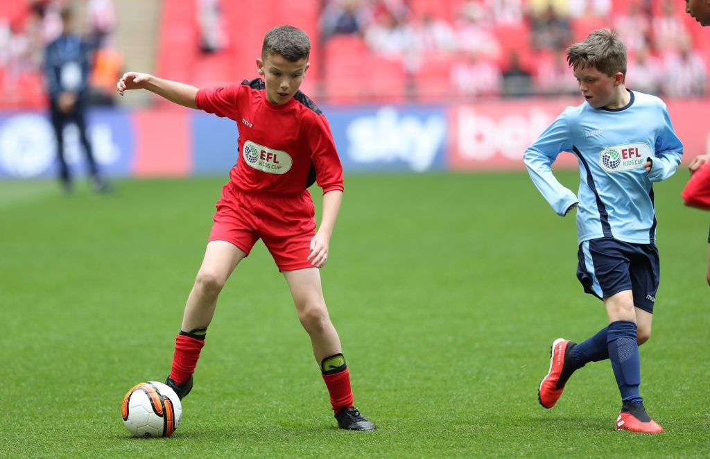 Wembley hosts the EFL Kids Cup where two children are shown here.