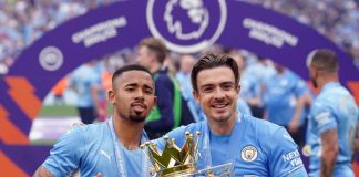 This is an image of Gabriel Jesus and Jack Grealish holding the Premier League trophy