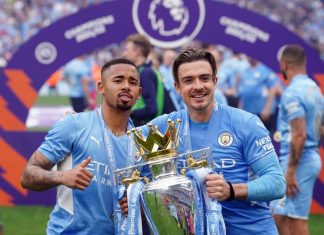 This is an image of Gabriel Jesus and Jack Grealish holding the Premier League trophy