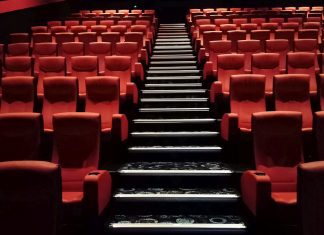 This image show a photo of empty cinema seats