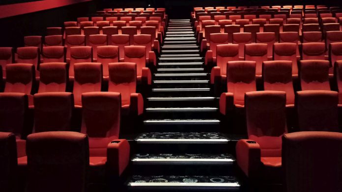 This image show a photo of empty cinema seats