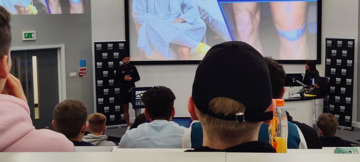 Photo of Olympian Ben Williams speaking to students at the University of Derby 