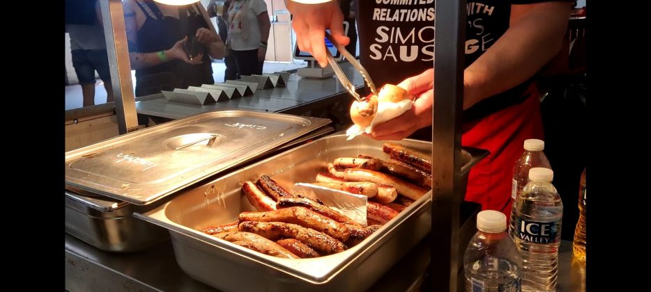 This is an image which shows sausages being cooked