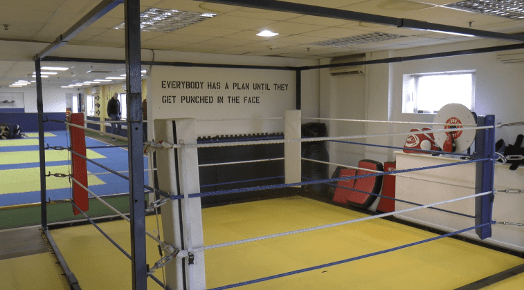 A boxing ring with a yellow canvas