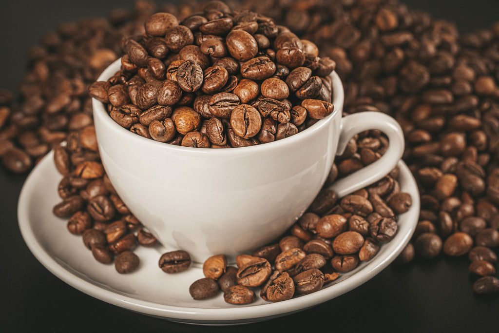 An image of coffee beans in a mug