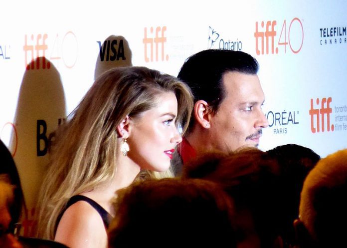 This is an image that shows both Johnny Depp and Amber Heard posing for a picture together