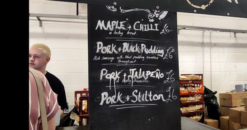 This is an image which shows the menu for sausages at sausage and cider fest.