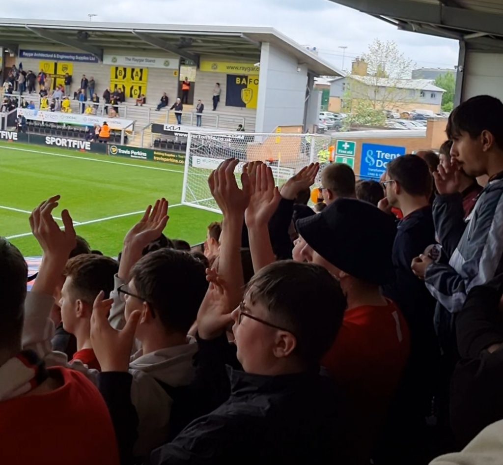 Picture of MK Dons fans in the Burton Albion away end