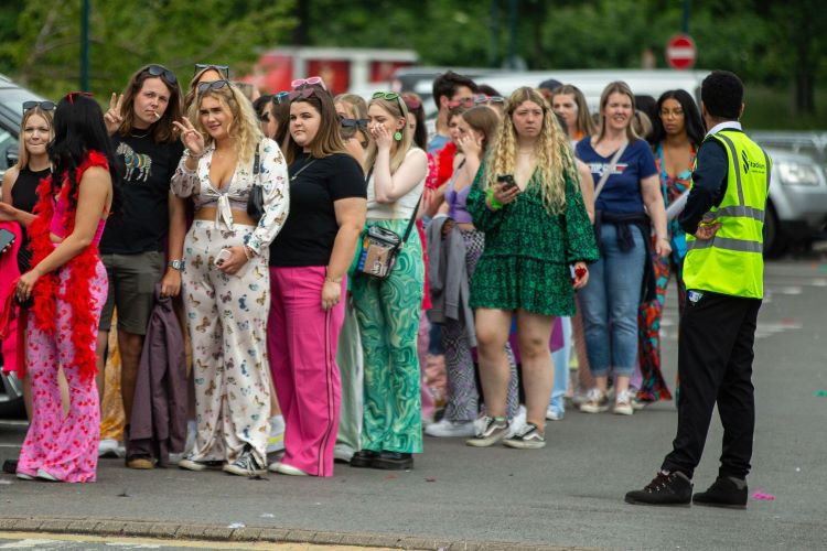 This is an image of fans queuing to see Harry Styles. 