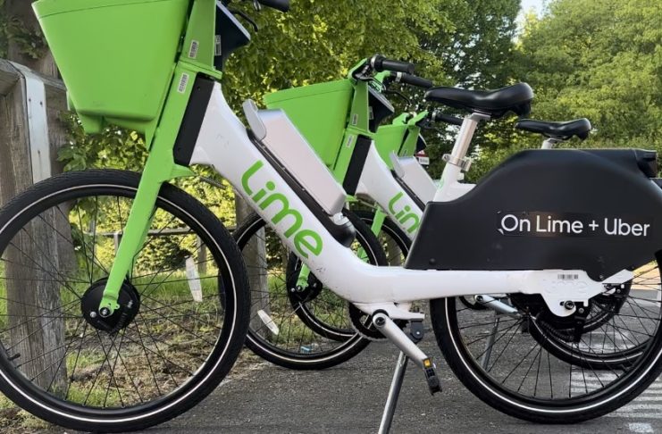 Lime E-bikes line up in dedicated areas across Derby. Credit: Harry Merrell
