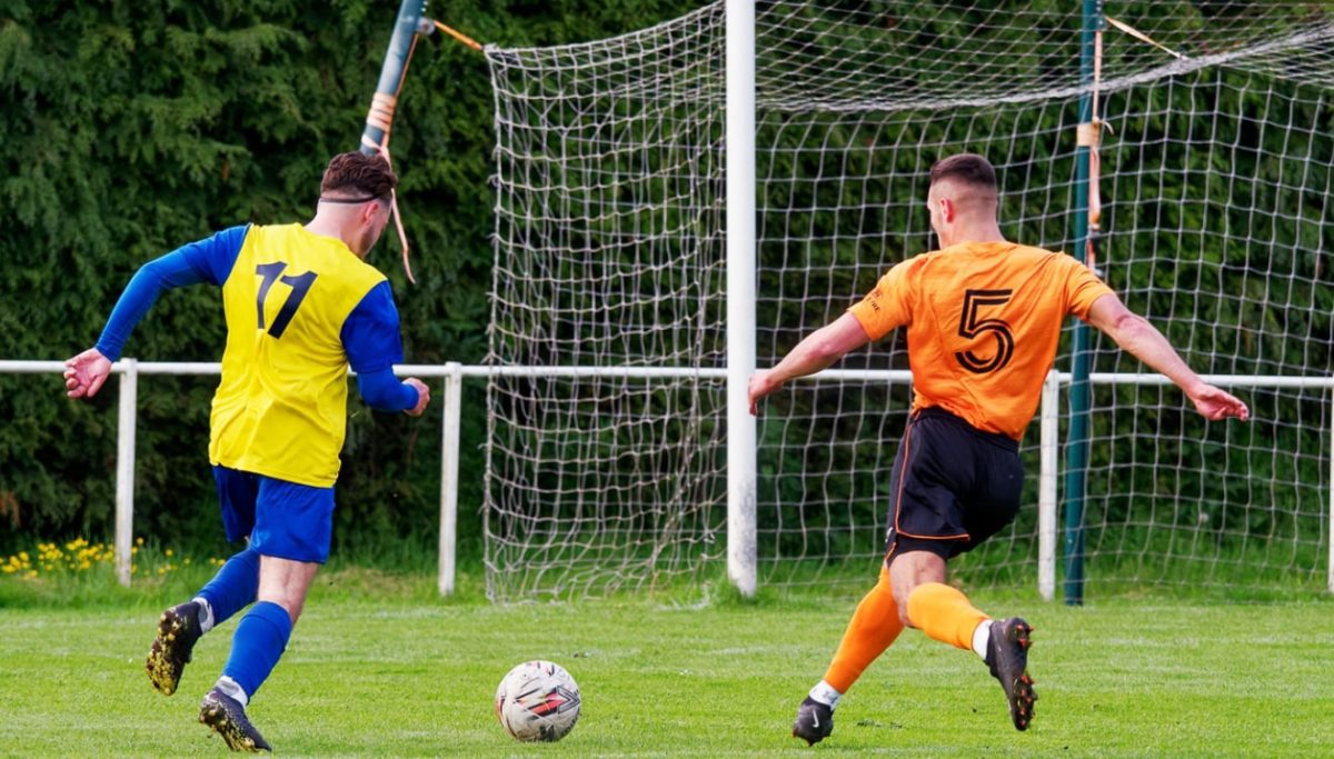 Lichfield City defender Leighton McMenemy closing down an opponent