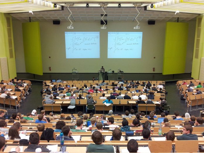 This is a photo of university students in a lecture theatre