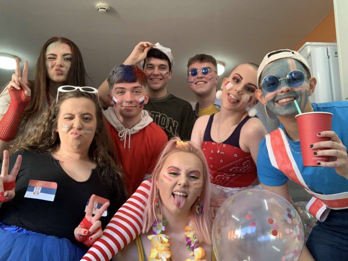 An image of a group of friends dressed up for a Eurovision party.