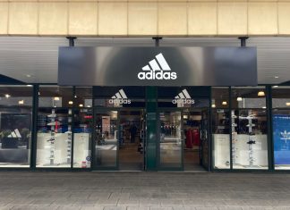 This is a picture of the entrance to an Adidas store.