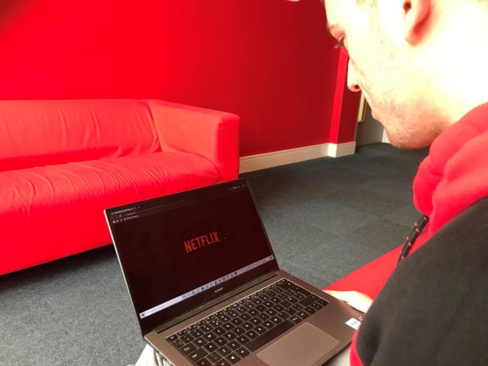 A viewer looking at Netflix.
