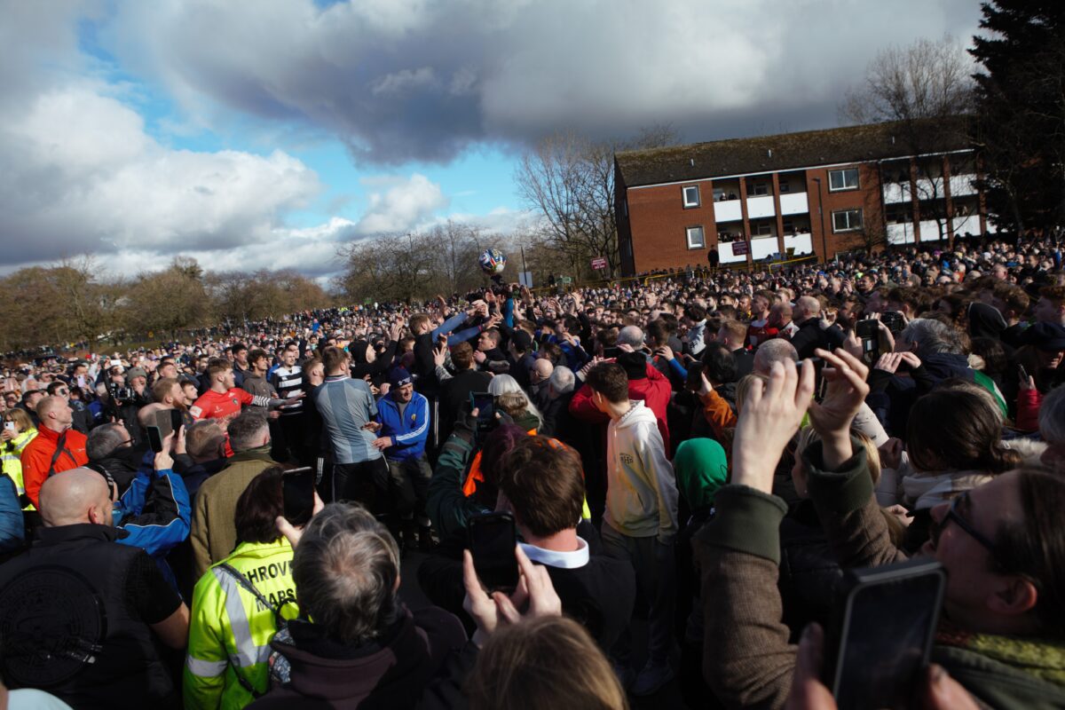 This image shows the crowd in Ashbourne surrounding the ball at the annual Shrovetide event in 2023