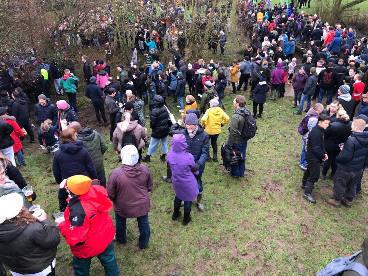 This image shows a crowd of people in Ashbourne for Shrovetide