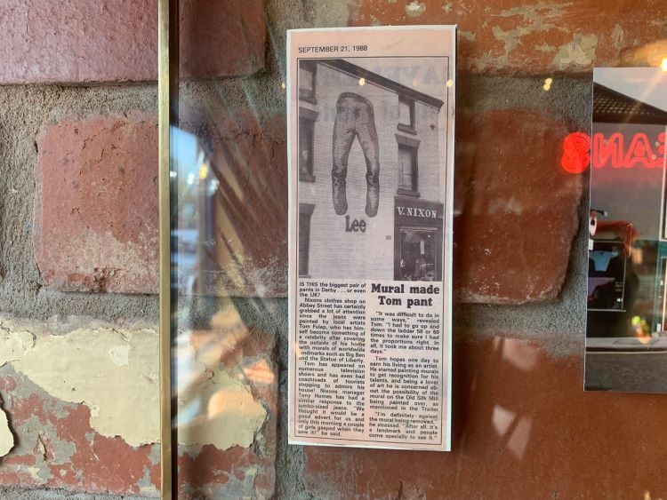 Glass display of newspaper article about Nixon Jean. 