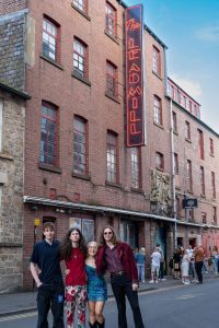 Spirals band in front of The Leadmill sign. Photography by Chloe Dearden.