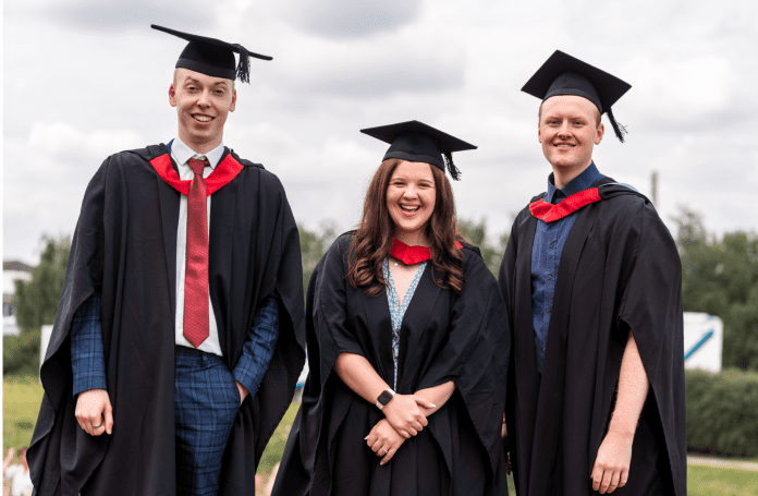 Three University of Derby graduates lined up, two of which who now work at Eighteen.