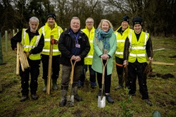 Cabinet Member for Infastructure and Environment Councillor Carolyn Renwick (front right) and Woodland Creation Advisor Iaian Stafford (front left) with members ofbthe tree planting team