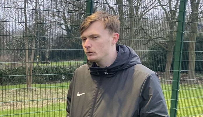 Derby women's seconds manager Tyler Denson during an interview