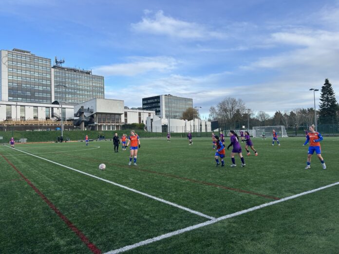 Derby women's firsts battle for the ball with Loughborough women's thirds at Kedleston Road.