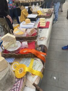 This image shows Staffordshire Cheese's stall at the Derby farmers market.