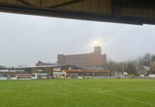 Five non-league football clubs to visit in Derbyshire An image of the Raygar Stadium being overlooked by the Belper Mill complex