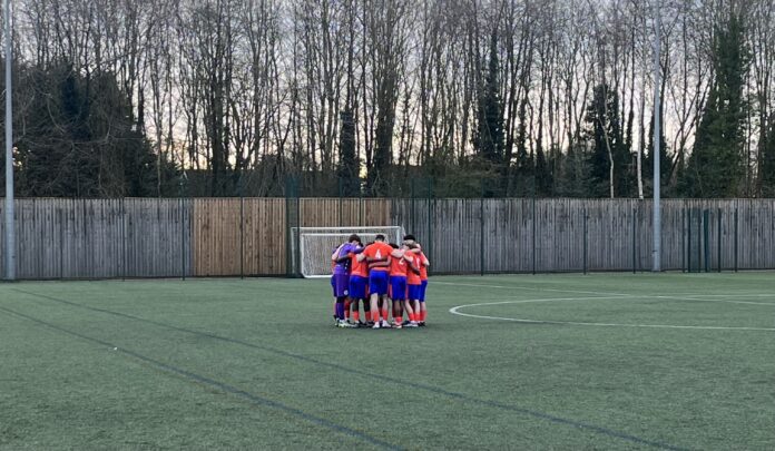 An Image of the ProChance squad in a pre-match huddle