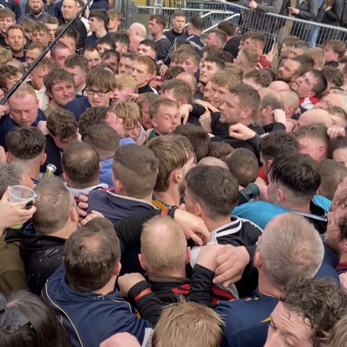 The hug of shrovetide football, where Players are tightly packed holding onto the ball