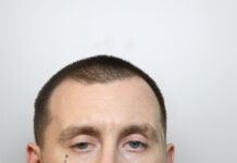 Man jailed after being convicted of 31 crimes police mug shot of Christopher Howell