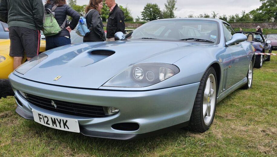 A blue Ferrari 550 Maranello