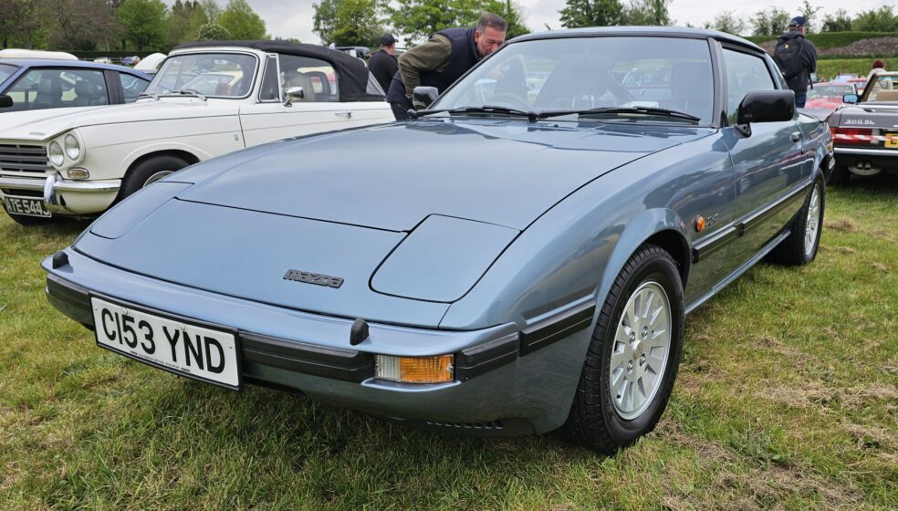 A blue Mazda RX-7 MK1