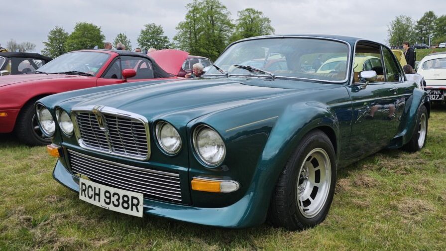 A green Jaguar XJC