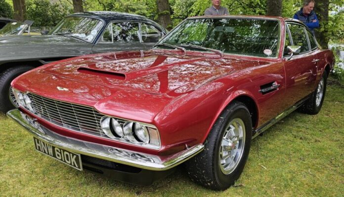 A red Aston Martin DBS V8